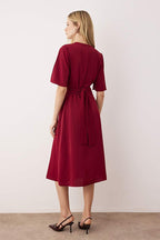 The Buckle Twist Midi Dress