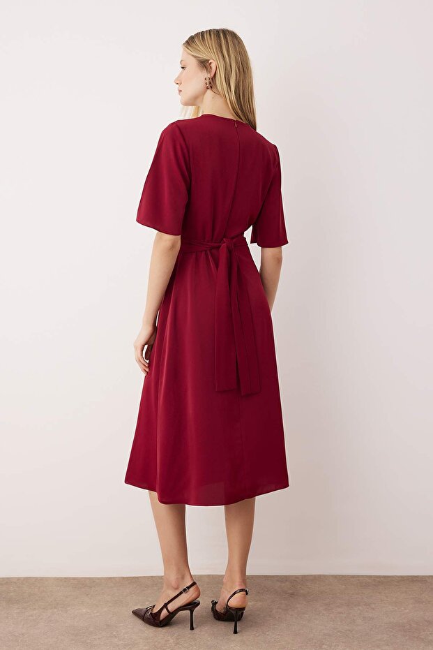 The Buckle Twist Midi Dress